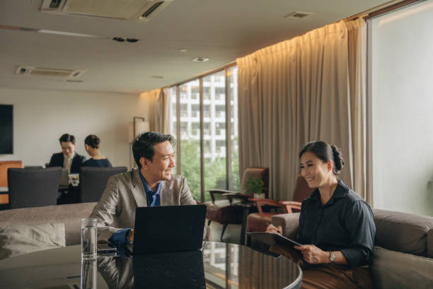 business partners discuss commercial deal, contract details at formal meeting