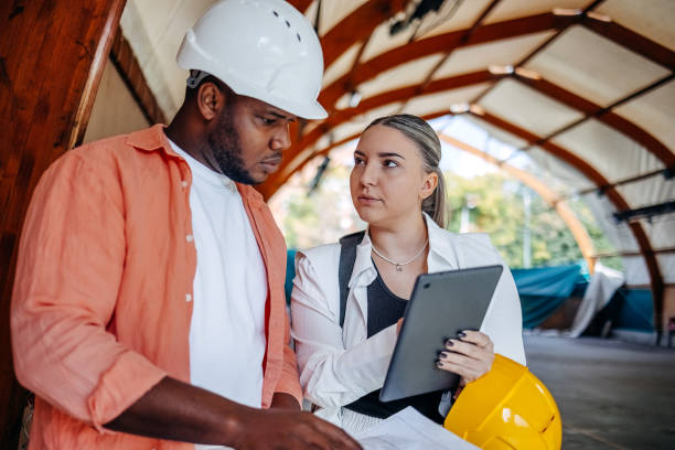 colleagues working together checking for damage on construction